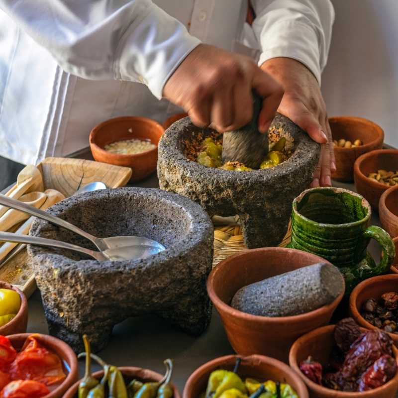 Chef preparing a traditional Pasilla Chili Sauce 