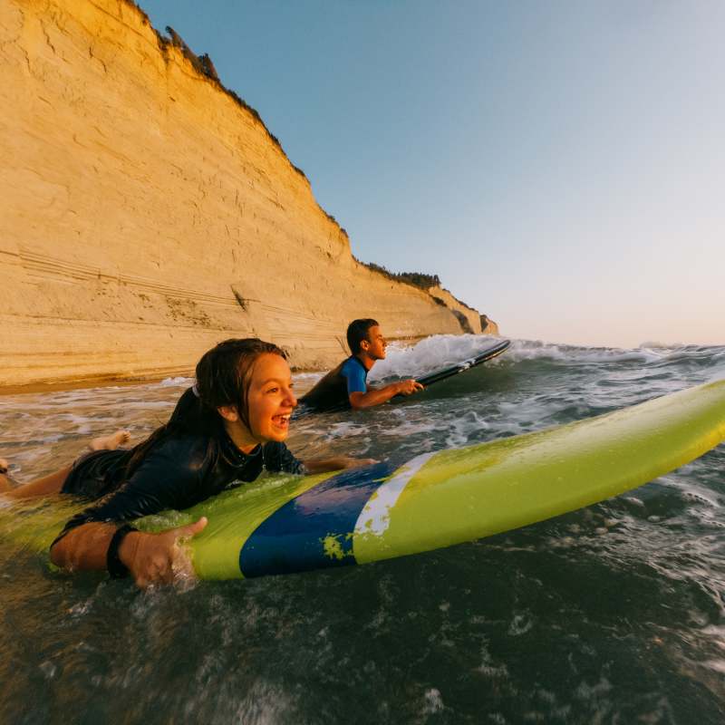 Kids surfing in the ocean