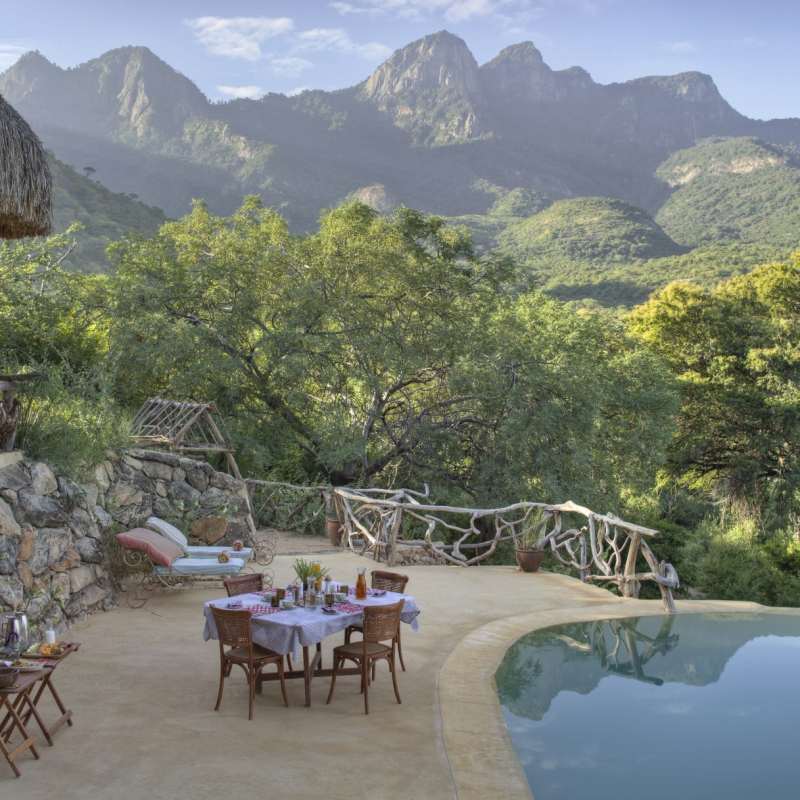 Dining by swimming pool