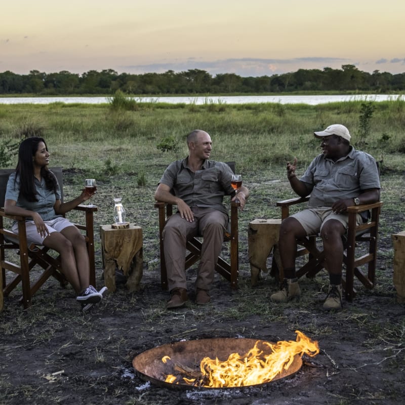 Sundowners around the fire - Kuthengo Camp