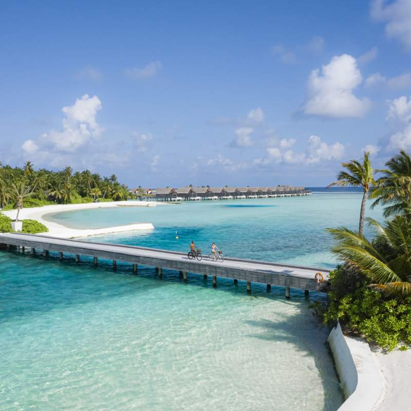 Bridge with couple cycling  