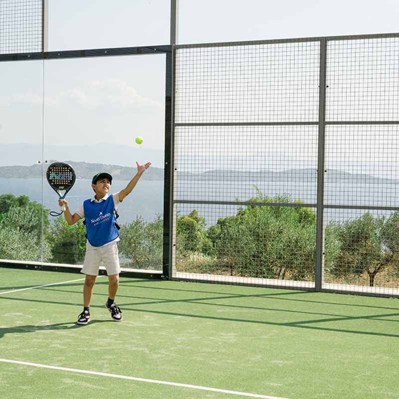 Child playing tennis