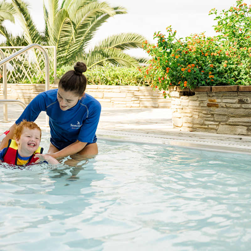 Child swimming in pool